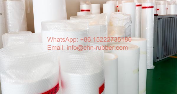 Mechanical grade PTFE skived sheet roll stock stacked in factory warehouse for industrial gasket stamping